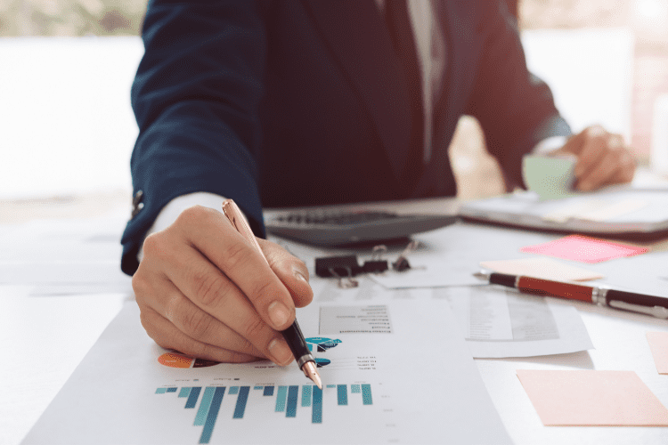 A man in a suit is conducting an audit.