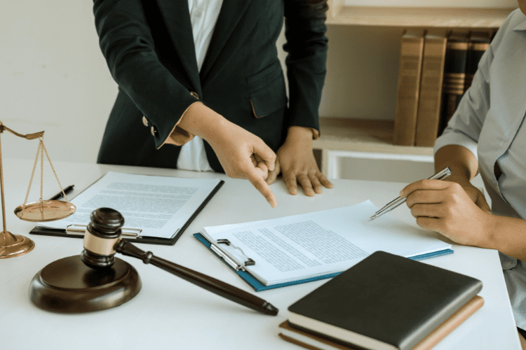 Two chartered accountants performing a statutory audit with a judge and gavel.