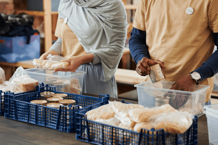 Two charity workers prepare donations