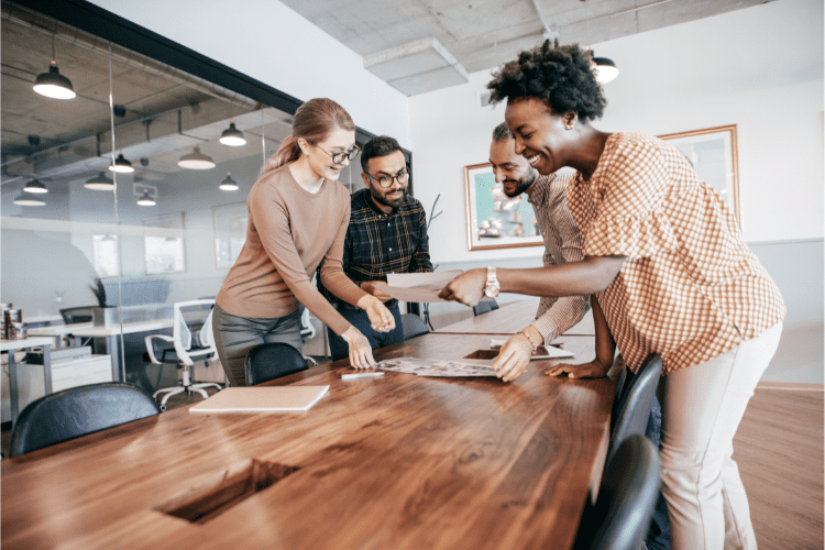 Businesspeople smiling and working together